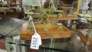 A set of brass postal scales with weights. S Morden London.