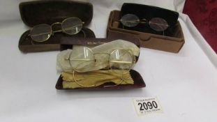 Three pairs of vintage spectacles.