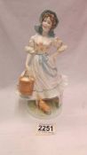 A limited edition Royal Worcester Old Country ways figurine - 'The Milkmaid', 1016/9500.