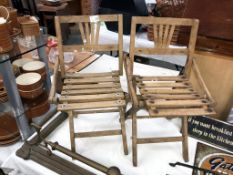 A pair of vintage childrens slatted folding garden chairs