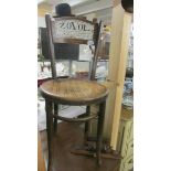 A bentwood chair with Zovol signage.