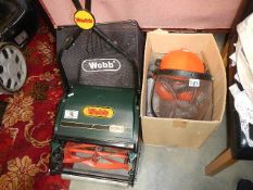 A good Webb manual mower, guard hat and other tools.