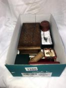 A box of miscellaneous including pill boxes, tie clips,