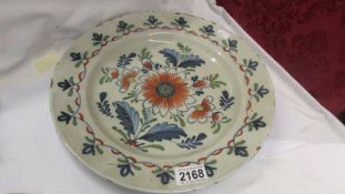 a late 18th/early 19th century Delft plate, a/f (nibble around the rim).