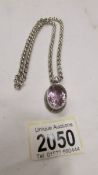 A heavy quality silver pendant set oval amethyst on a belcher link chainr, 48 grams.