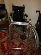A wheel chair and a walking aid.