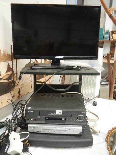 A television on stand with video and DVD player, in working order. - Image 3 of 4