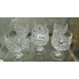 A set of six cut glass whisky tumblers.