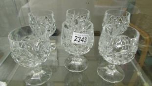 A set of six cut glass whisky tumblers.