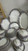 48 pieces of early 20th century dinner ware including meat platters, tureens etc.