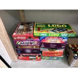 A quantity of various board games and jigsaws,
