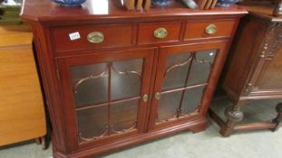 A good quality two door mahogany glazed cabinet.