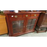 A good quality two door mahogany glazed cabinet.