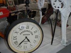 A wall mounting 'Paddington Station' clock.