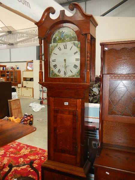 An oak cased grandfather clock by W Farnhill, Rotherham.