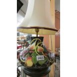 A Moorcroft table lamp with shade.