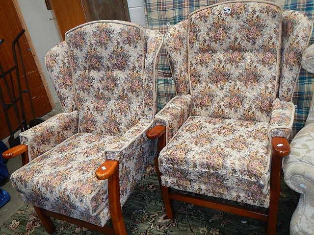 A pair of wing arm chairs.