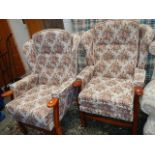 A pair of wing arm chairs.