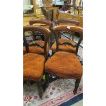 A set of four mahogany dining chairs.