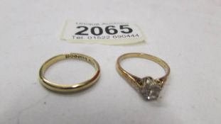 A 9ct gold wedding ring, size k and a 9ct gold engagement ring, size M half, 3.3 grams.