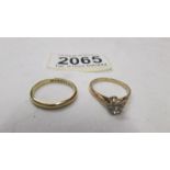 A 9ct gold wedding ring, size k and a 9ct gold engagement ring, size M half, 3.3 grams.