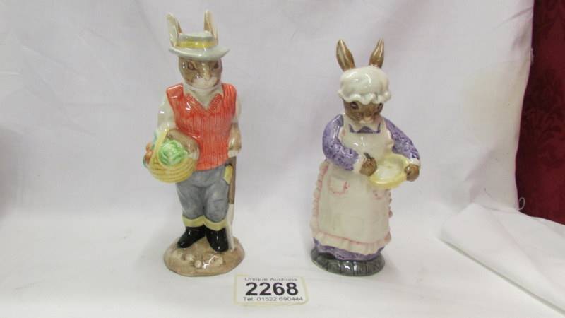 Two Beswick figurines - Mrs Rabbit baking and Gardener Rabbit.