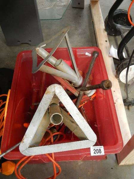 A box containing car axle stands.