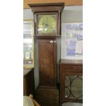An oak cased 8 day long case clock with brass dial.