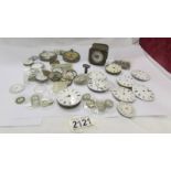 A quantity of watch parts including movements, dials etc.