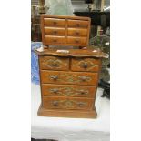 A miniature 2 over 3 chest of drawers and one other.