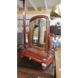 A Victorian mahogany toilet mirror.