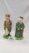 Two Beswick figurines - The Gentleman Pig and The Lady Pig.