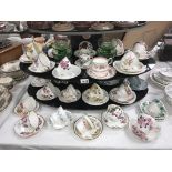 A quantity of porcelain trio's & cups & saucers including Royal Albert etc.