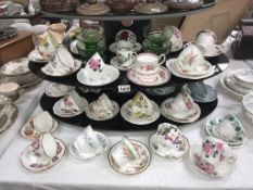 A quantity of porcelain trio's & cups & saucers including Royal Albert etc.