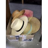 A quantity of vintage hats including straw boater etc.
