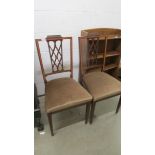 A pair of mahogany inlaid chairs.