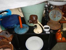 An enamel bucket, TV table and old kitchen items.