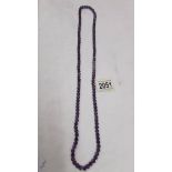 A natural deep colour amethyst necklace with approximately 120 beads.