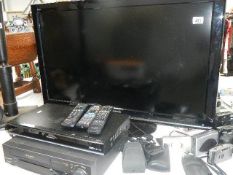 A television, DVD player and video recorder.