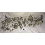 A Collection of 21 x silver plate animal figures circa 1980 including dogs, horses, rabbits, birds,