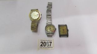 Two gent's wrist watches and a watch head.