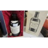 An 1842 Macallan Malt Whisky of Speyside replica bottle of whisky.