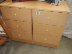 A pair of three drawer bedsides.