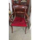 A mahogany elbow chair.