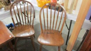 A pair of Ercol style kitchen chairs.