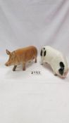 Two Royal Doulton pigs.