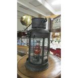 A vintage candle lantern converted to electric.