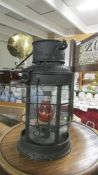 A vintage candle lantern converted to electric.