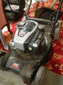 A petrol lawn mower in good condition.