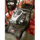 A petrol lawn mower in good condition.